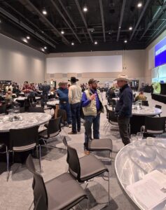 People chatting at the conference in Rapid City, SD
